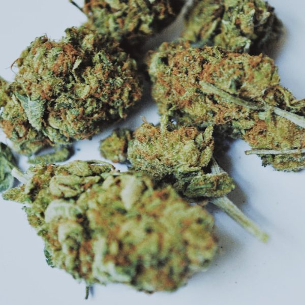 green kush on white surface